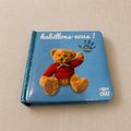 Libro bebé táctil con oso y ropa
